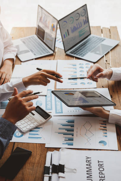 Accounting team, Cropped shot of diverse coworkers working together in the boardroom, brainstorming, discussing, and analyzing business strategy.